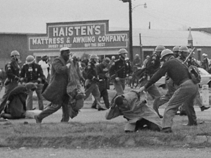 John Lewis Endures a brutal beating during a peaceful protest on the Edmund Pettus bridge in Selma, Alabama